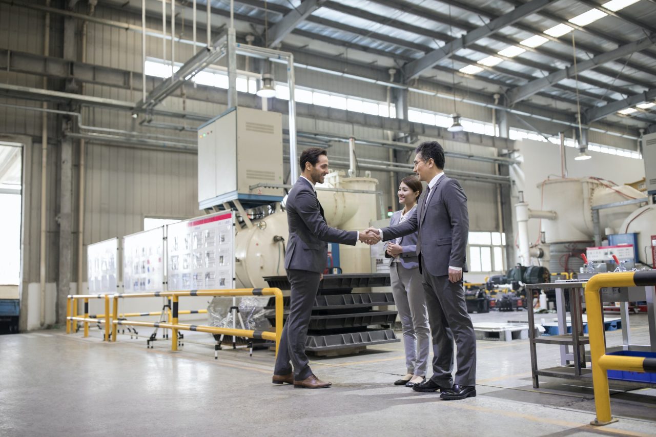 business-people-shaking-hands-in-the-factory.jpg